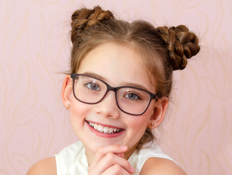 smiling kid wearing eye glass