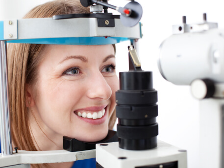 smiling woman having eye exam