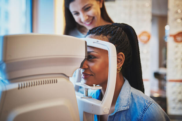 woman using our advanced technology for her eye exam