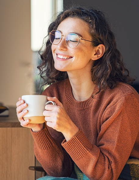 girl-holding-cup advanced technology at premier eye associates